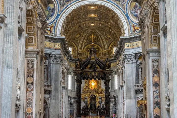 a group of people in front of St. Peter's Basilica