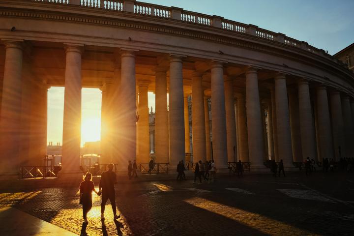 a building with a sunset in the background