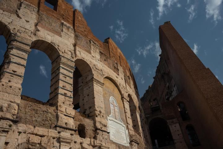 a large brick tower with a clock on the side of a building