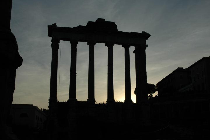 a building with a sunset in the background