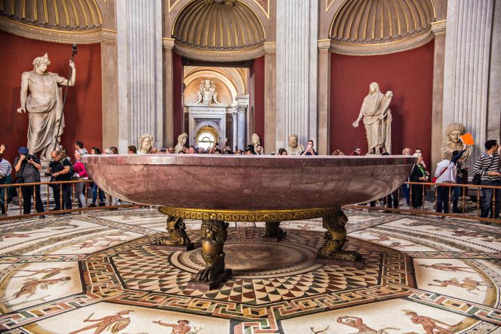 a group of people sitting in front of a building