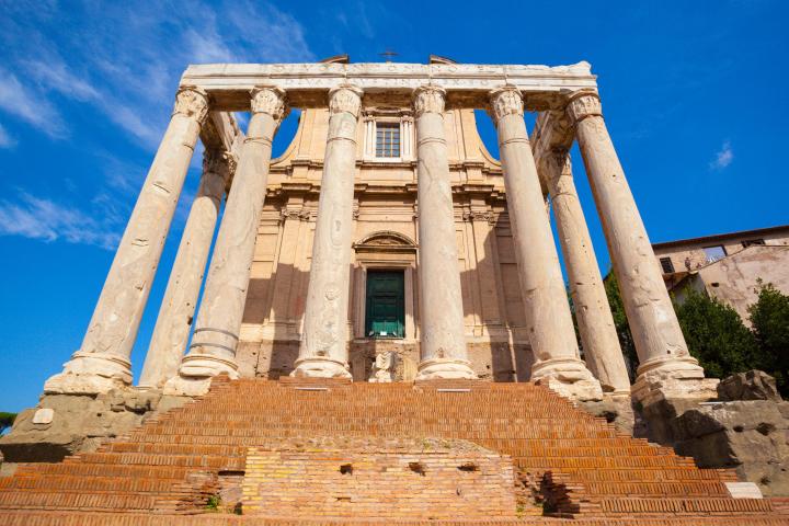 a large stone statue in front of a building