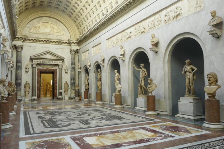 a large clock mounted to the side of a building