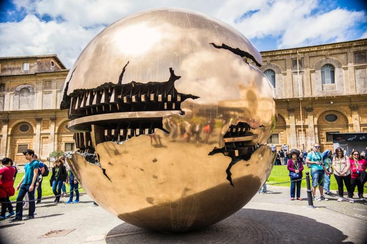 a group of people walking in front of a building