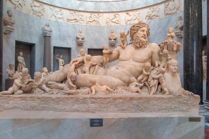 a group of sheep in front of a building