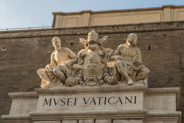 a wooden bench in front of a building