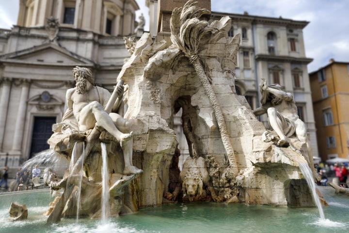 a statue in front of a building