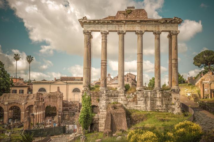 a stone building that has a bridge in the background