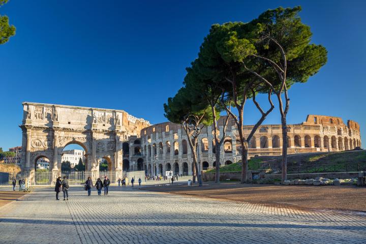 a group of people walking on a bridge