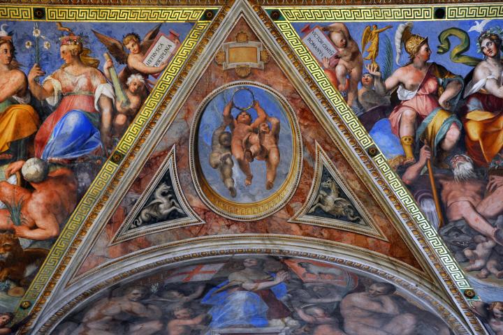 a group of people sitting on the side of a building