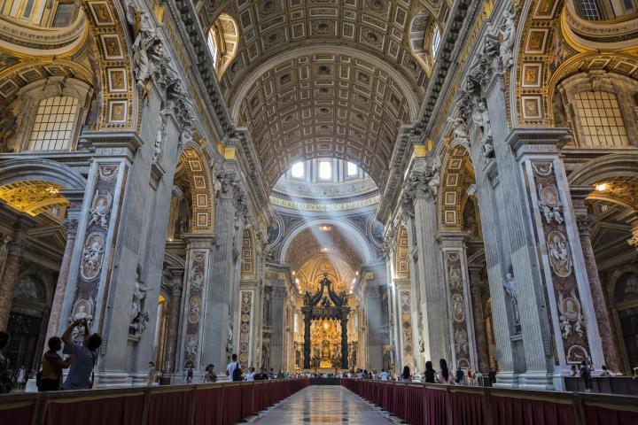 a large building with St. Peter's Basilica in the background