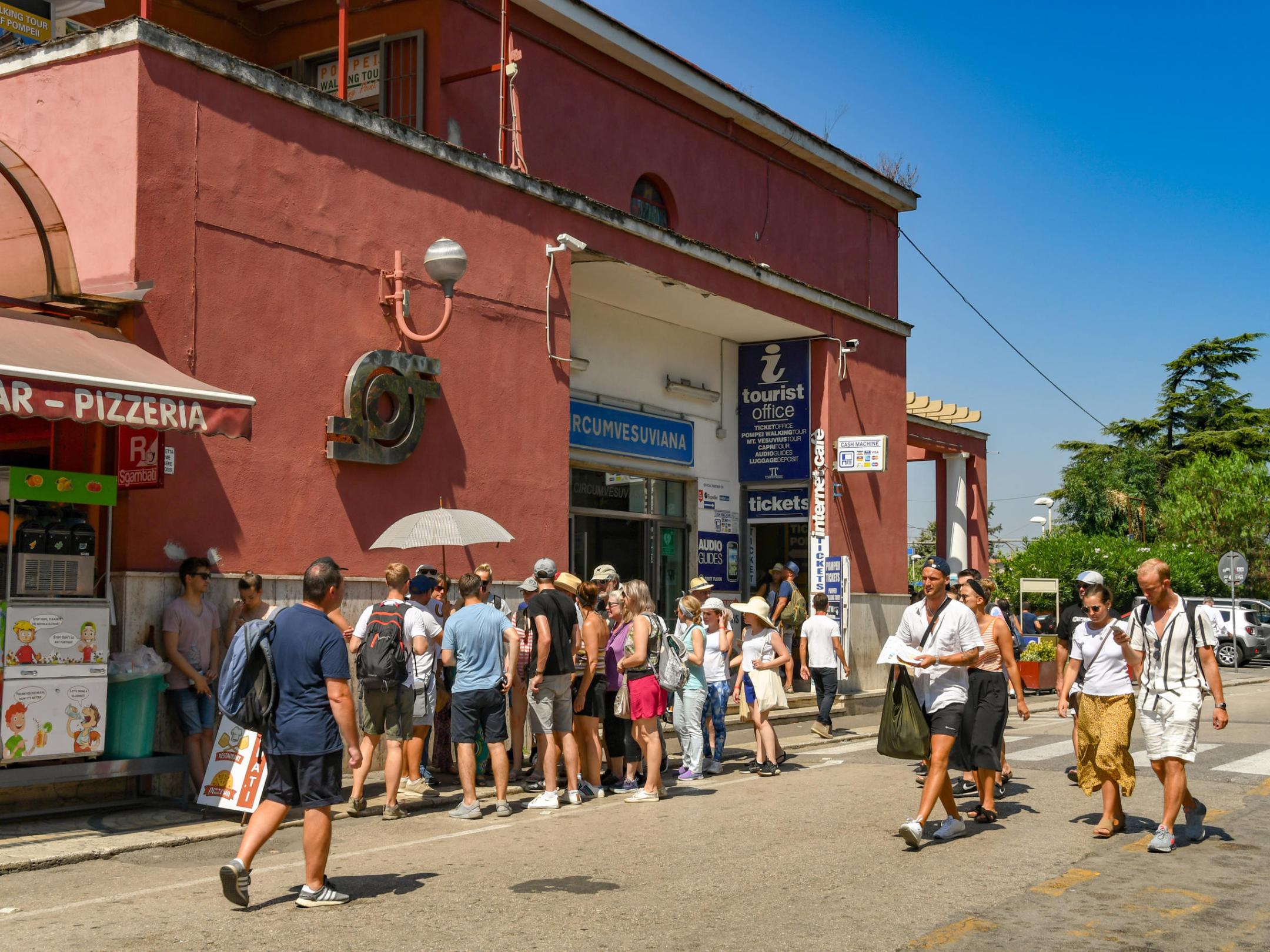 a group of people walking down a street
