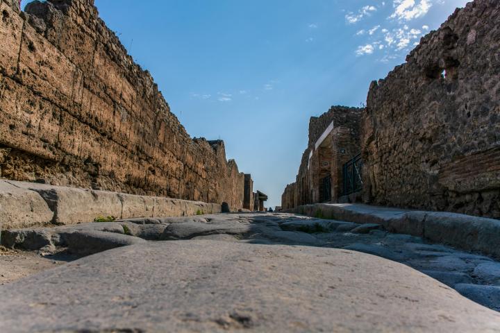 a stone building that has a rocky cliff