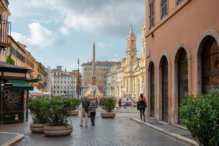 a large stone statue in front of a building
