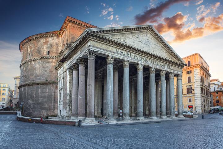 an old stone building with Pantheon, Rome in the background