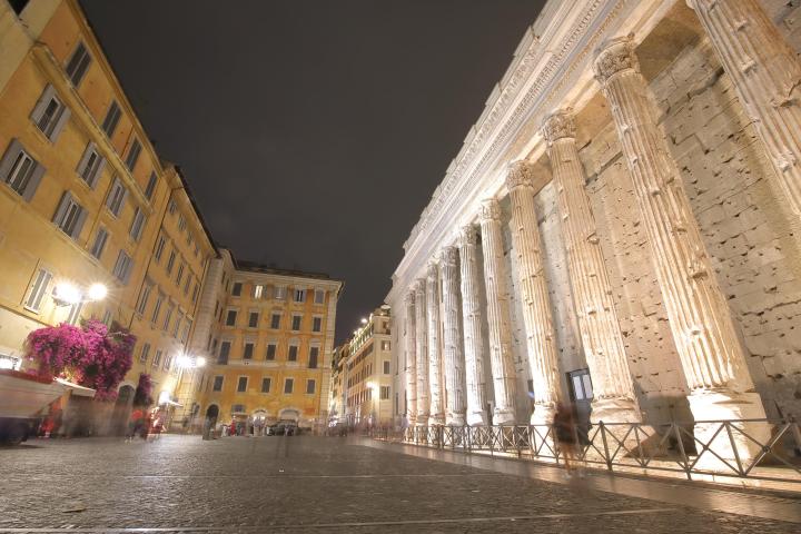 a group of people standing in front of a building