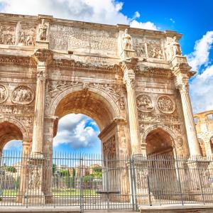 a large stone statue in front of a building