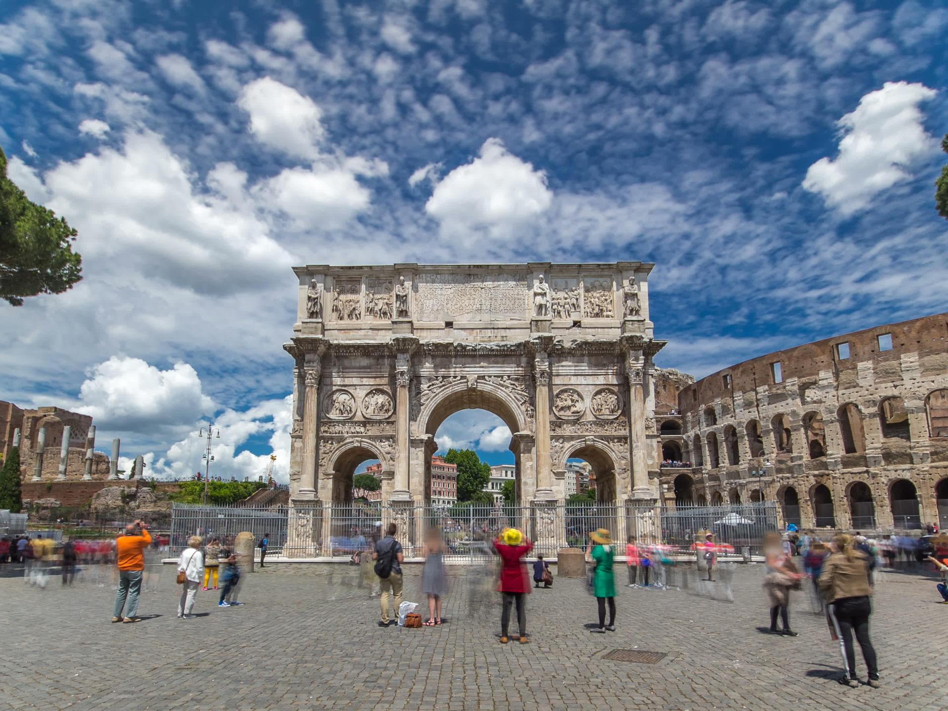 a group of people walking in front of a building