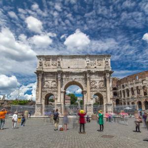 a group of people walking in front of a building