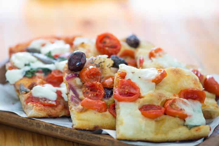 a close up of a slice of pizza