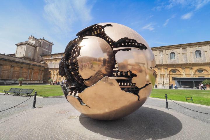 a person sitting on the side of a building