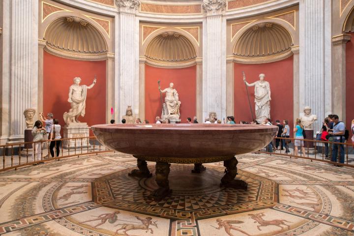 a group of people sitting in front of a building