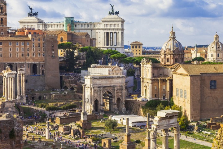 a castle with a clock on the front of Roman Forum