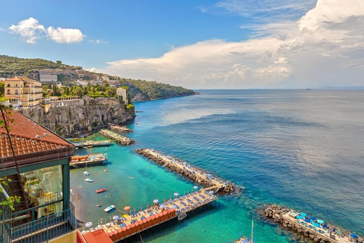 a large body of water with a city in the background