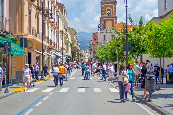 a group of people walking down the street