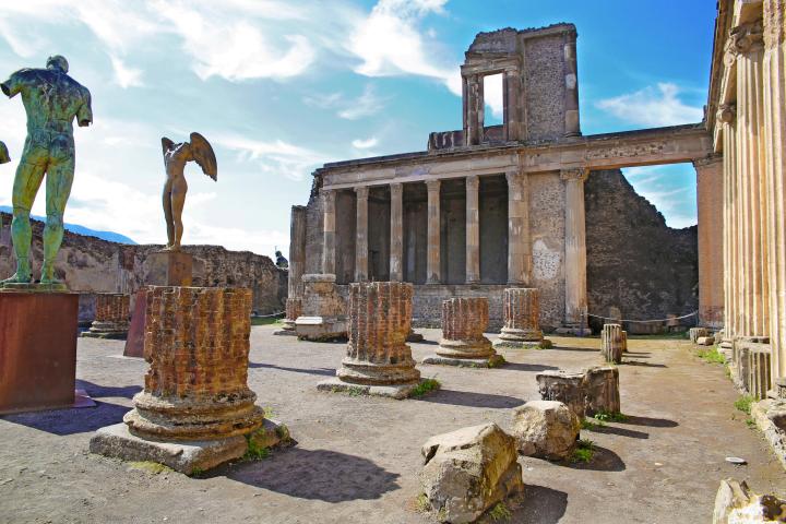 a large stone statue in front of a building
