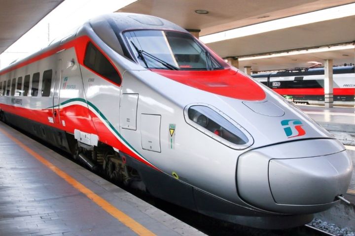 a passenger train pulling into a station