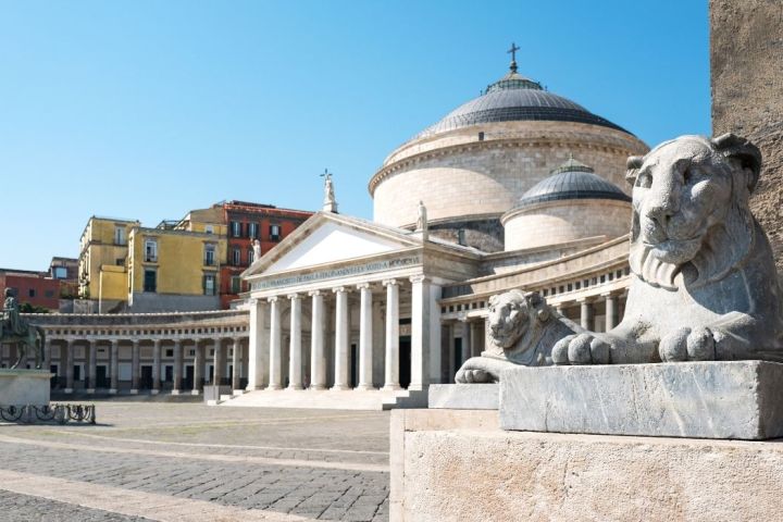 a statue in front of a building