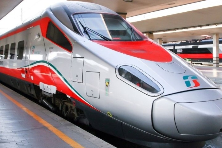 a passenger train pulling into a station