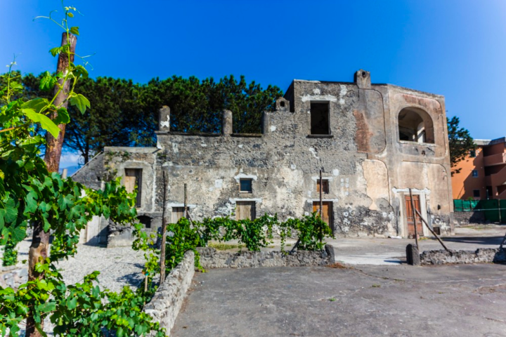 a statue in front of a brick building